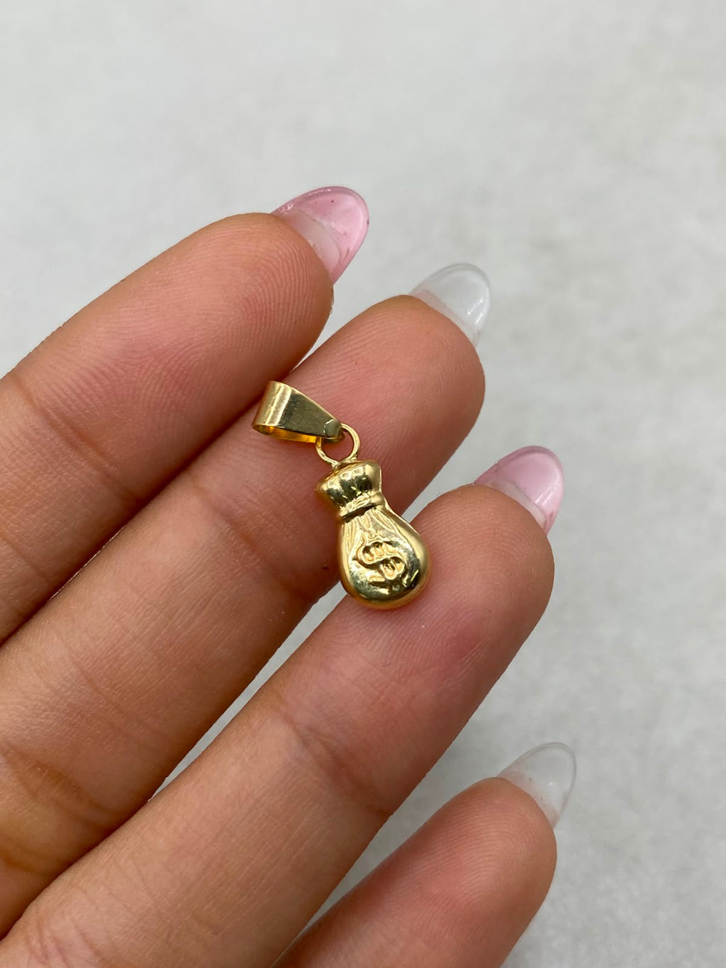 Dije bolsa de dinero Oro amarillo 18k 0,54 Gr / 6 mm / 1,5 Cm