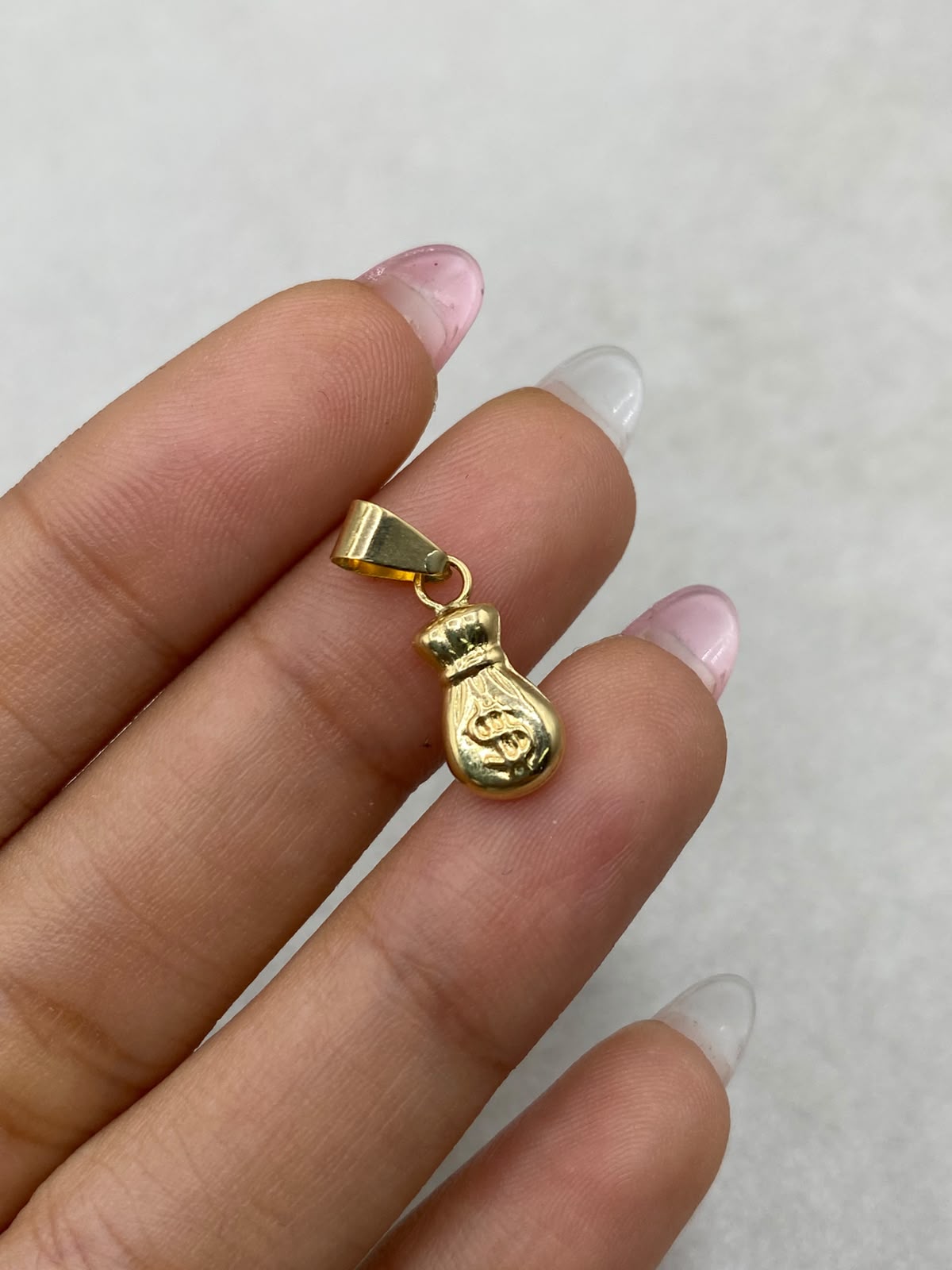 Dije bolsa de dinero Oro amarillo 18k 0,54 Gr / 6 mm / 1,5 Cm