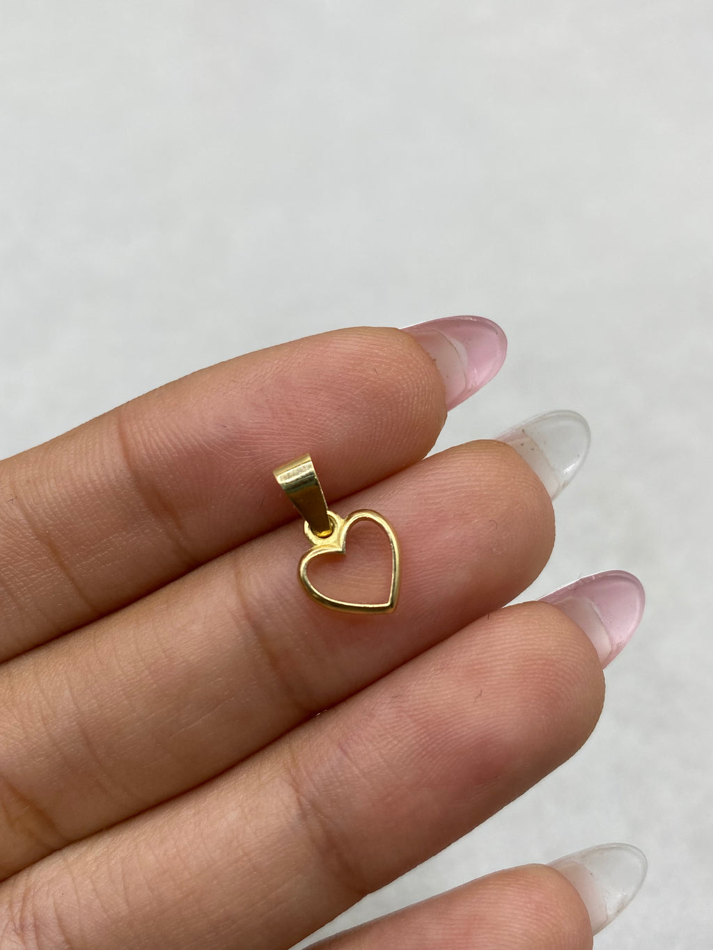 Dije silueta corazon (R) Oro amarillo 18k 0,52 Gr / 8,03 mm / 1,3 Cm