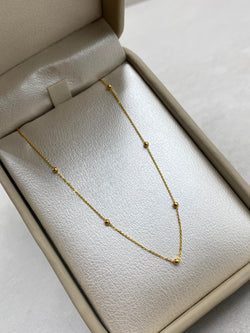 Cadena aro seguido con balines lisos  Oro amarillo 18k 1,55 Gr / 1,0 mm / 45 Cm