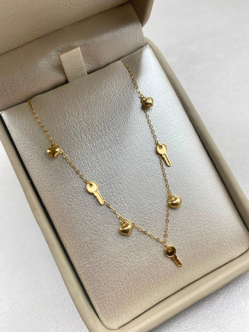 Cadena It aro seguido con dijes corazon y llaves  Oro amarillo 18k +3 / 1,46 Gr / 1,0 mm / 45 Cm