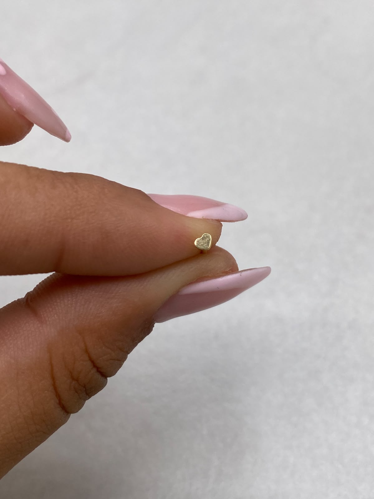 Piercing chispa corazon