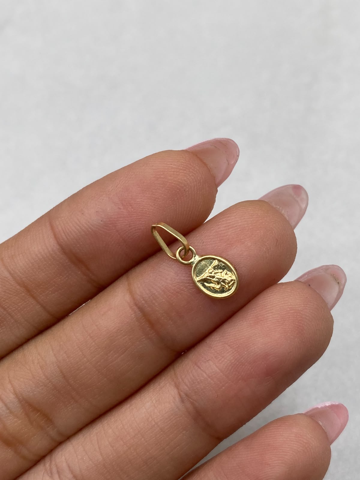 Dije mini san miguel de arcangel  Oro amarillo 18k 0,26 Gr / 5,80 mm / 1,5 Cm