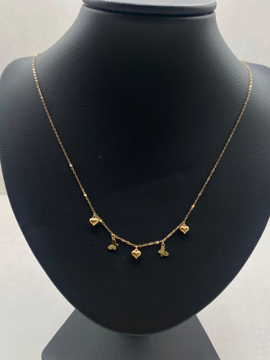Cadena It aro seguido con dijes corazones y mariposa  Oro amarillo 18k +3 / 1,09 Gr / 1,0 mm / 45 Cm