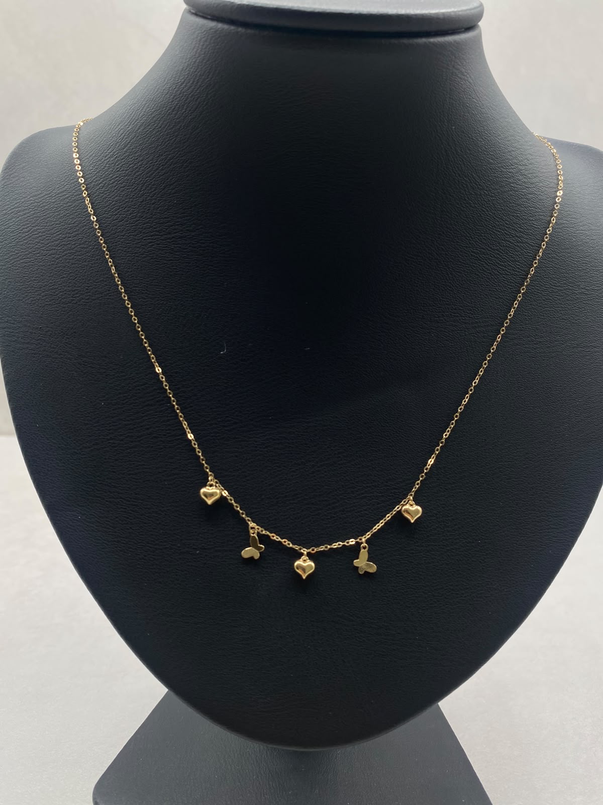Cadena It aro seguido con dijes corazones y mariposa  Oro amarillo 18k +3 / 1,09 Gr / 1,0 mm / 45 Cm