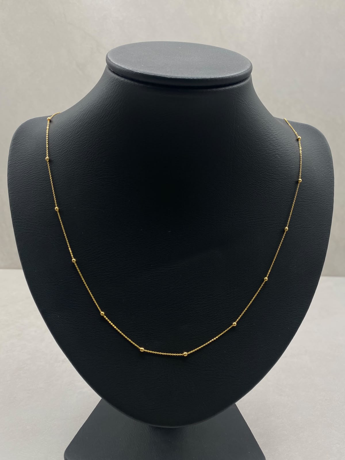 Cadena aro seguido con balines lisos  Oro amarillo 18k 1,55 Gr / 1,0 mm / 45 Cm