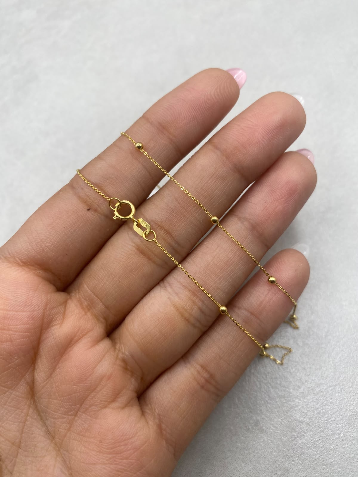 Cadena aro seguido con balines lisos  Oro amarillo 18k 1,55 Gr / 1,0 mm / 45 Cm