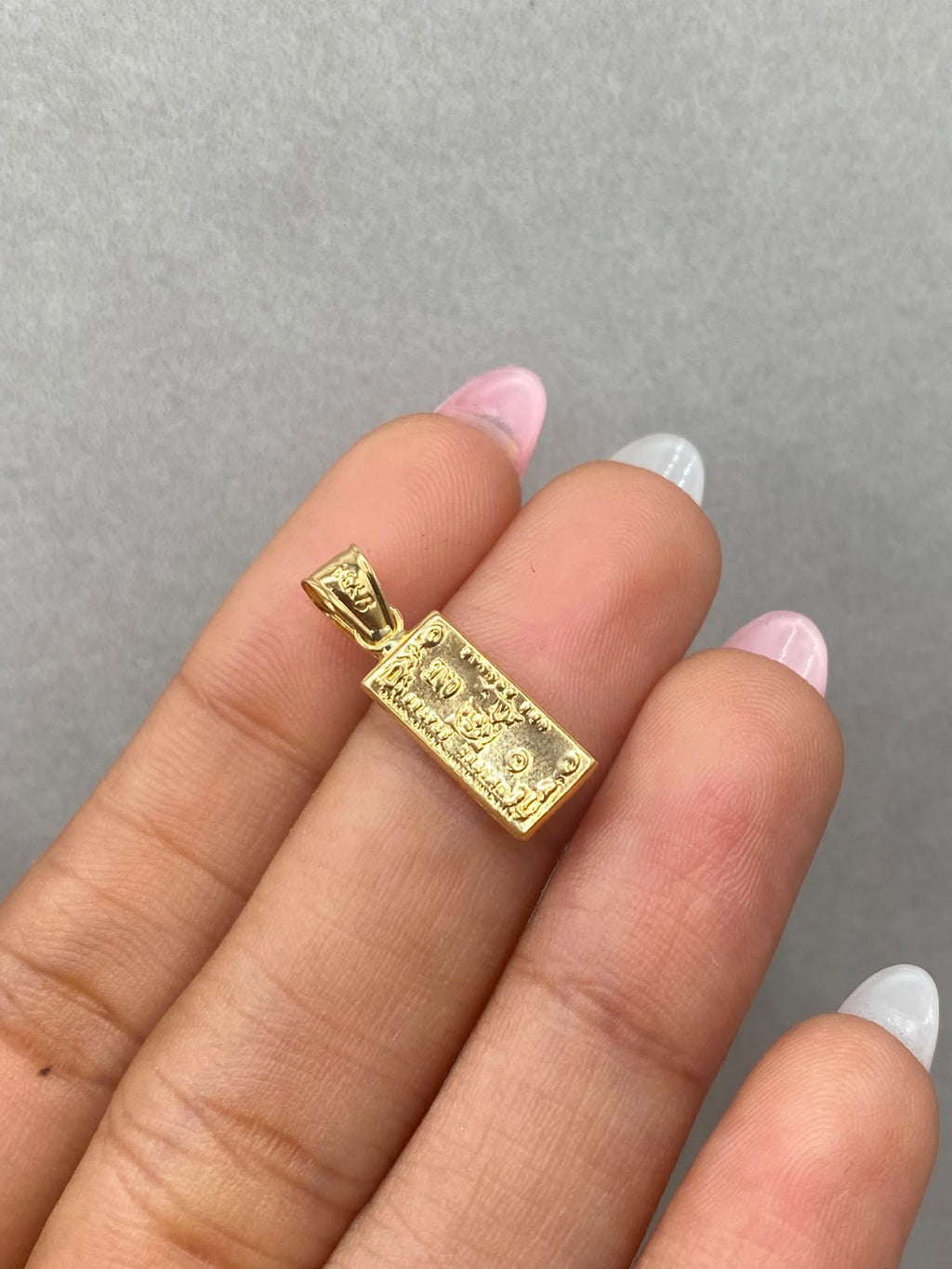 Dije one dollar  Oro amarillo 18k 0,64 Gr / 6 mm / 2,2 Cm