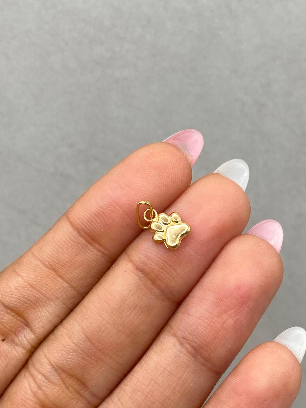 Dije huella  Oro amarillo 18k 0,32 Gr / 1,5 Cm