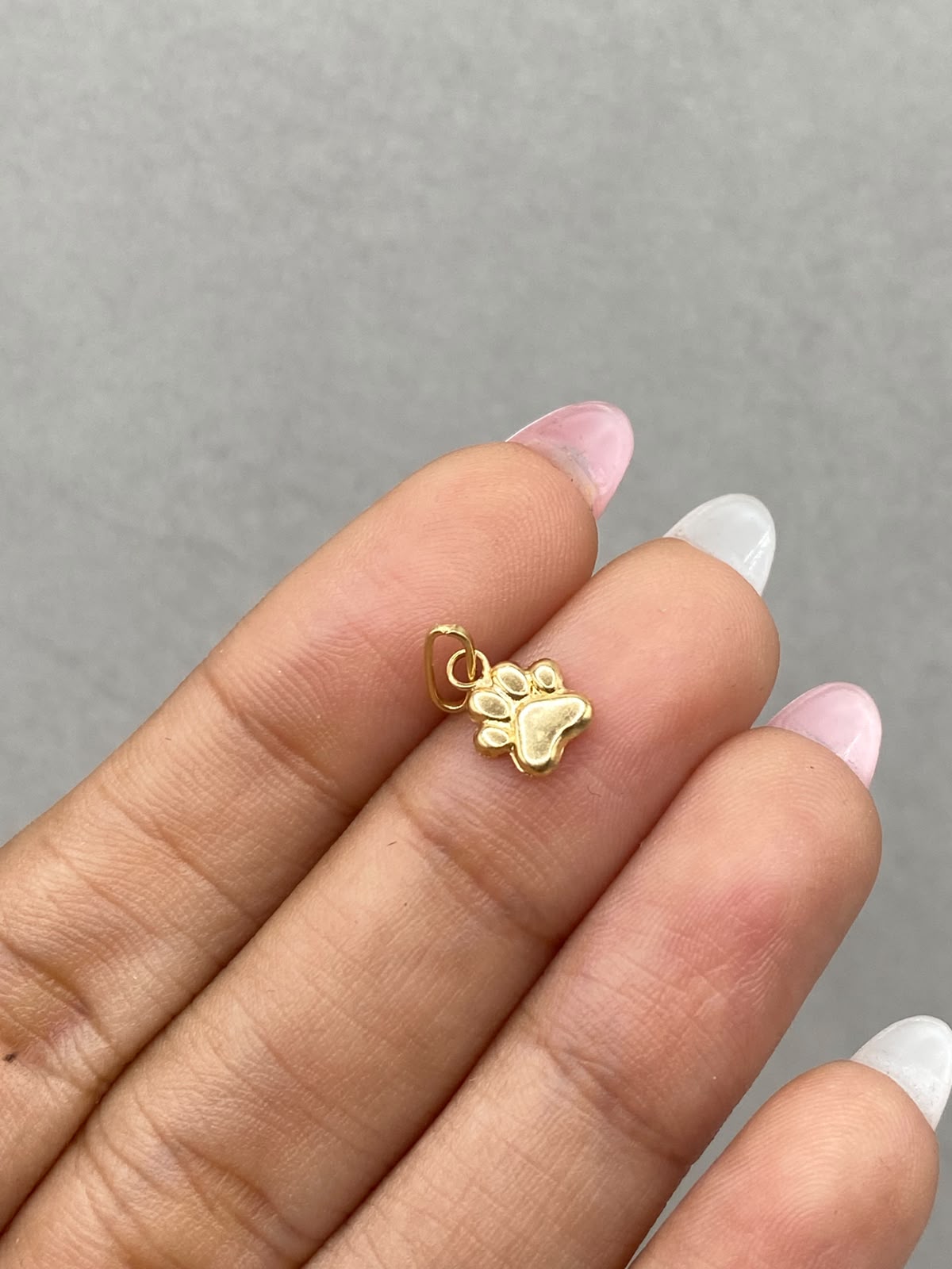 Dije huella  Oro amarillo 18k 0,32 Gr / 1,5 Cm